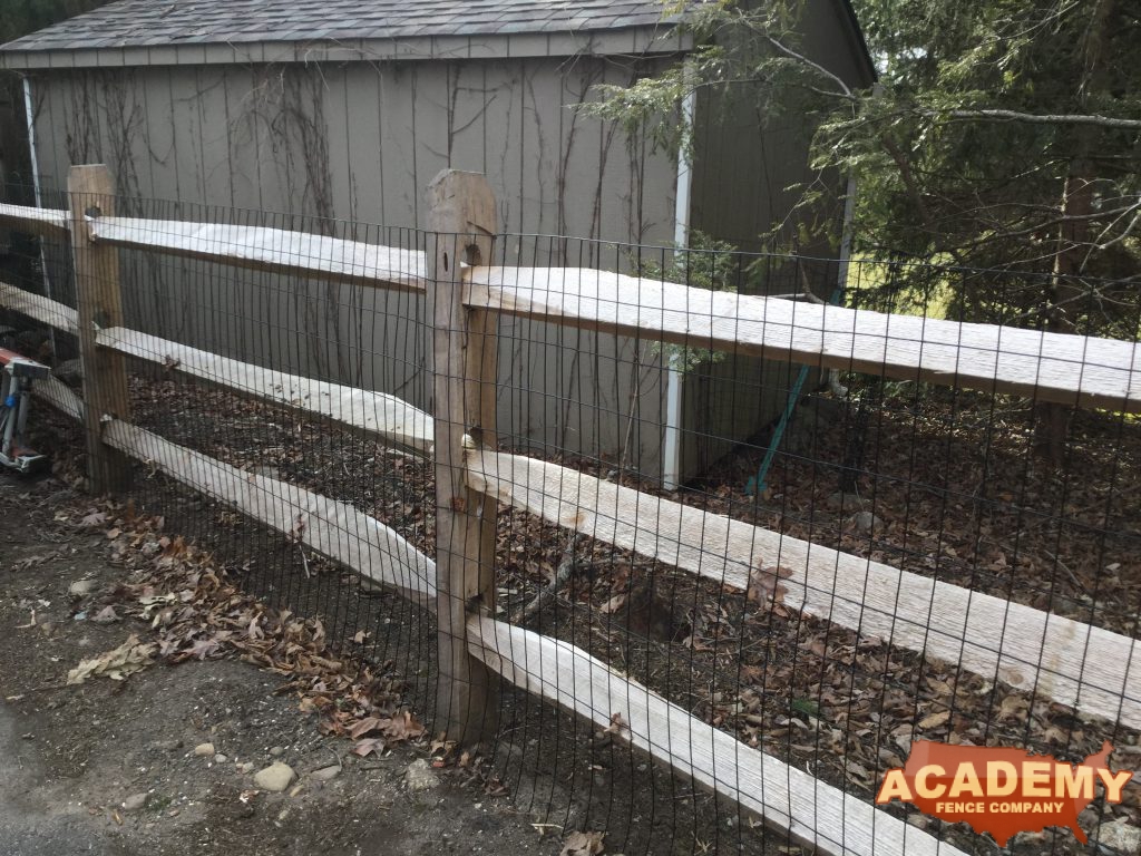 Post and rail with welded wire mesh attached installed by Academy Fence Company in Newark, NJ, Essex County.