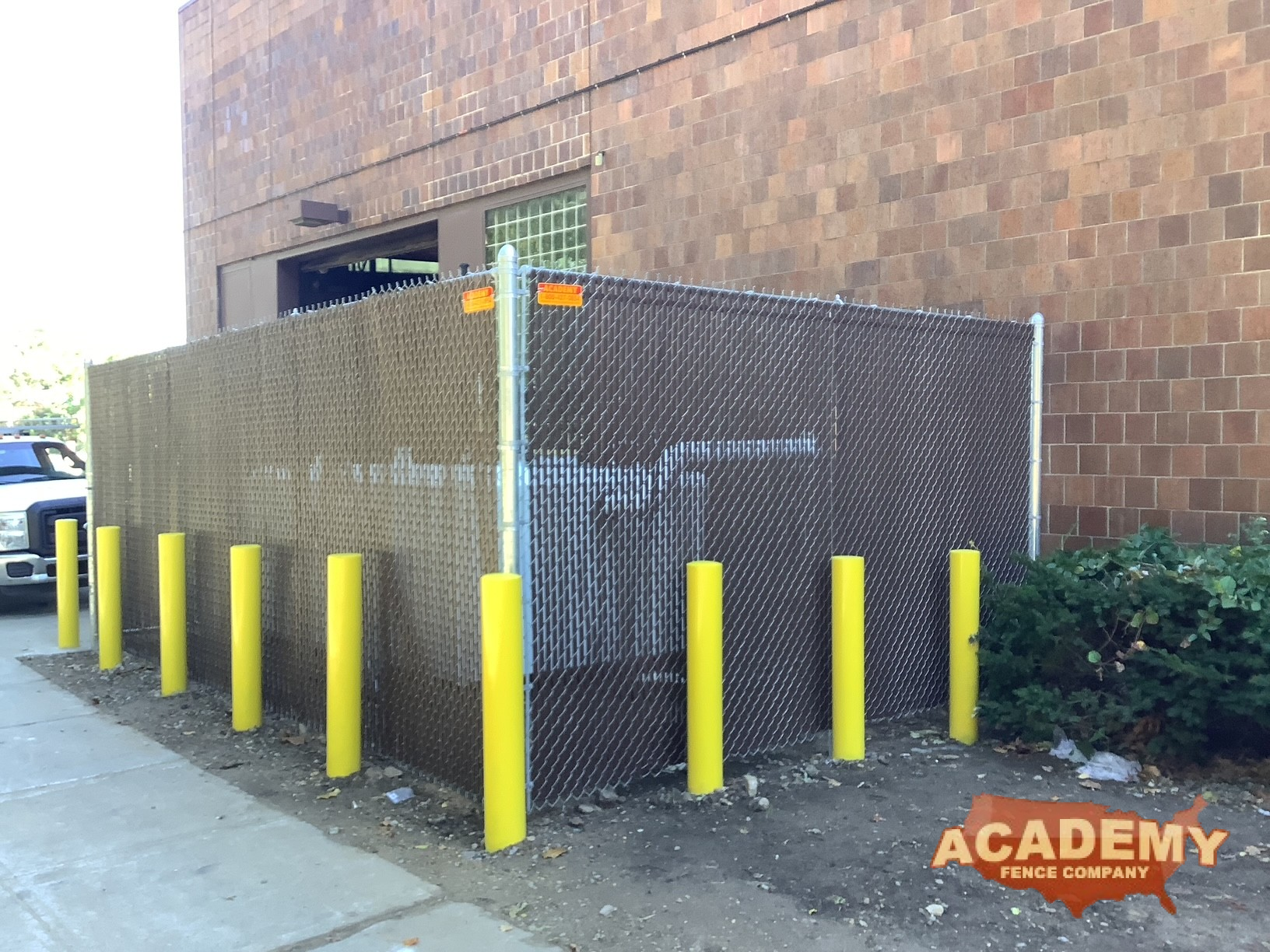 8ft high commercial chainlink enclosure with brown top lock privacy slats, and bumper posts, Orange NJ